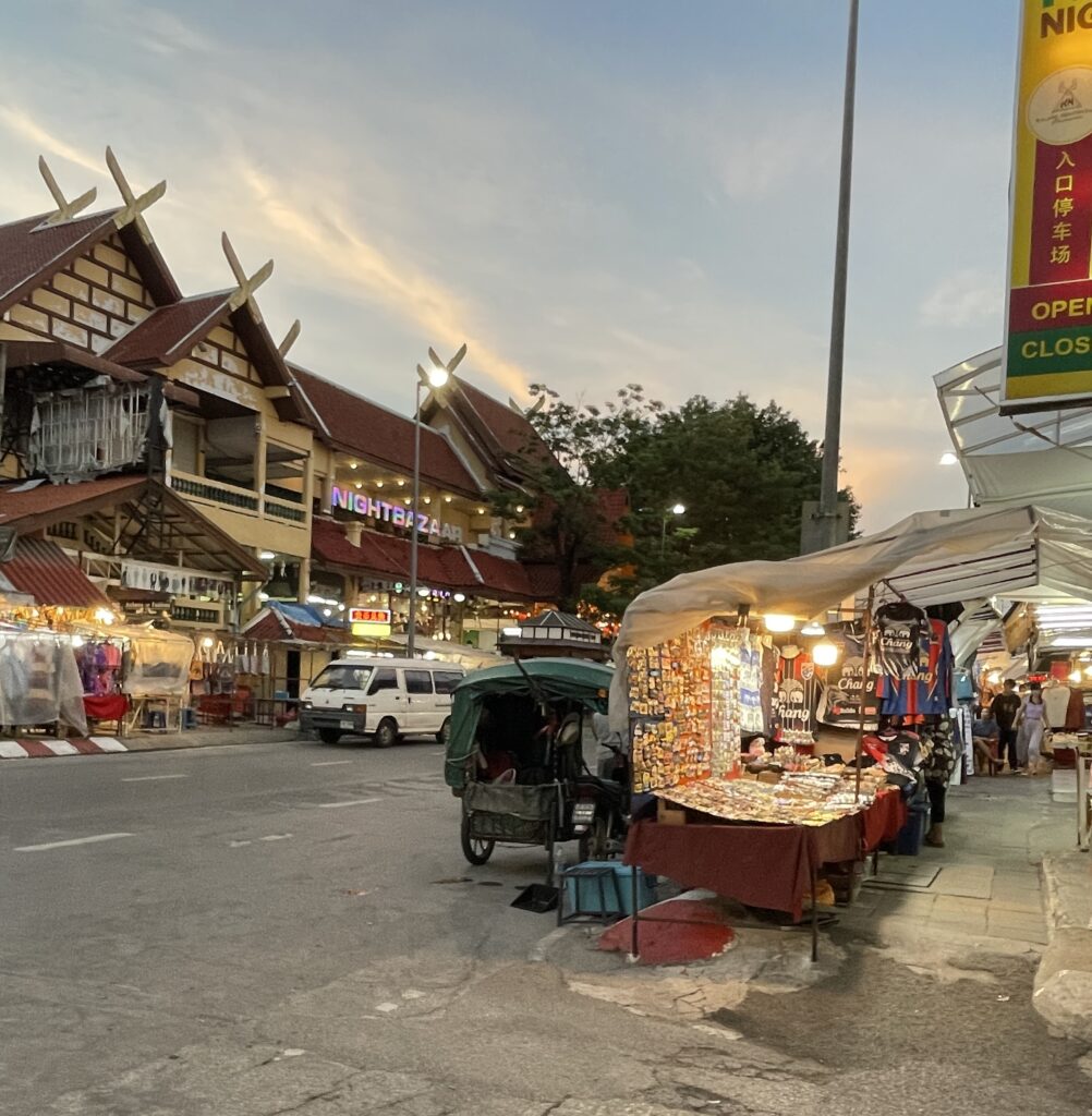 many vendors setting up their stalls in the evening on the Night Bazaar area in Chiang Mai