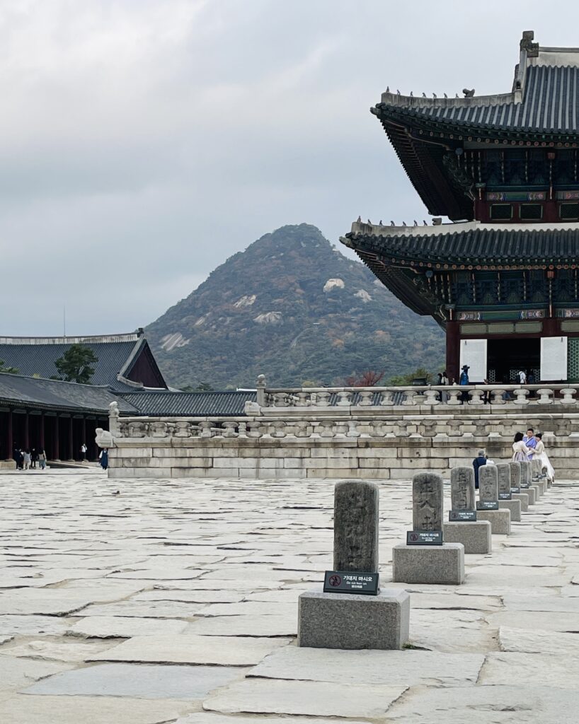 views of a mountain in the distance from the famous Gyeongbokgung Palace in Seoul
