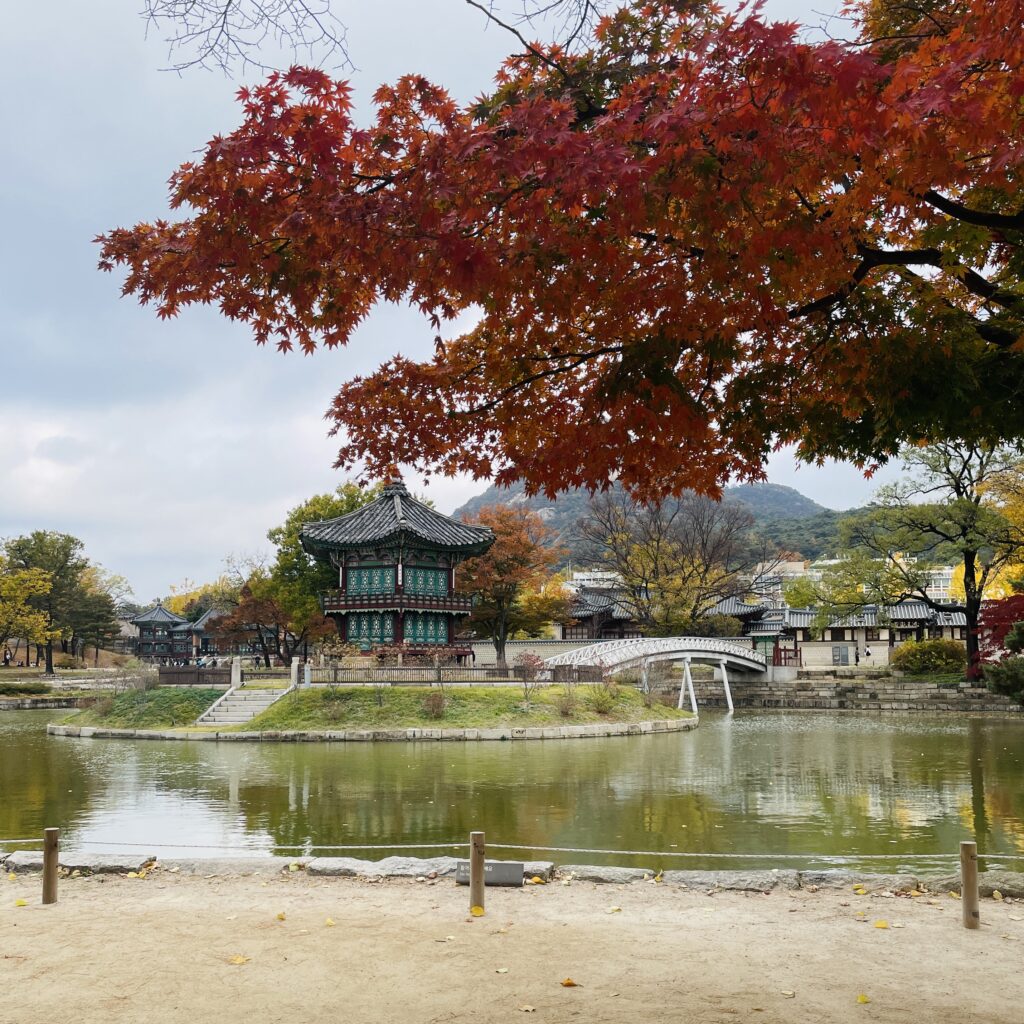 a stunning pond and ancient old Gyeongbokgung Palace in Seoul, South Korea