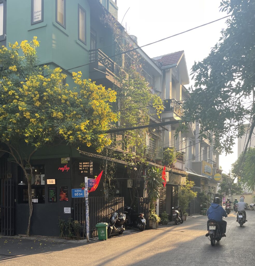 drivers driving their scooters on a sunny evening in the Thao Dien area of Ho Chi Minh City, Vietnam