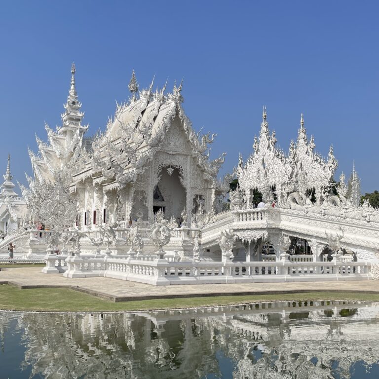 the famous White Temple on a clear sunny day in Chiang Rai, Thailand