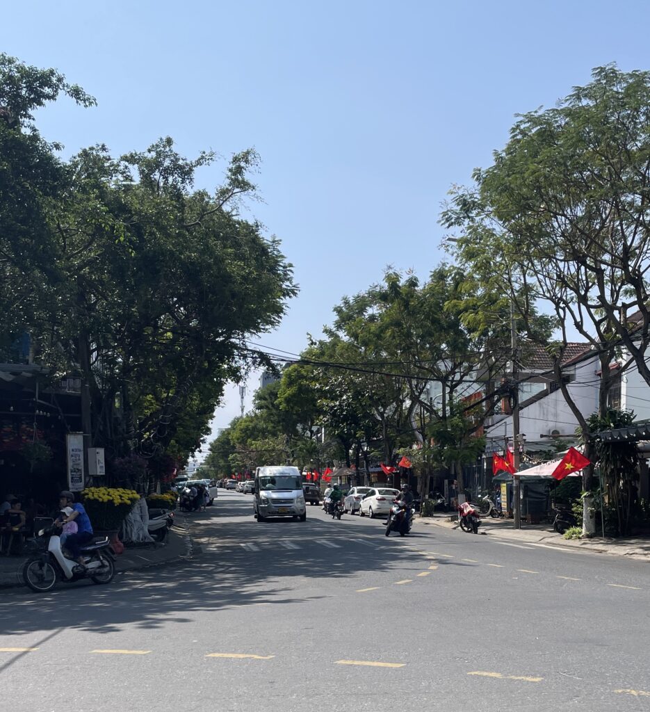scooters driving by on a sunny day in Da Nang