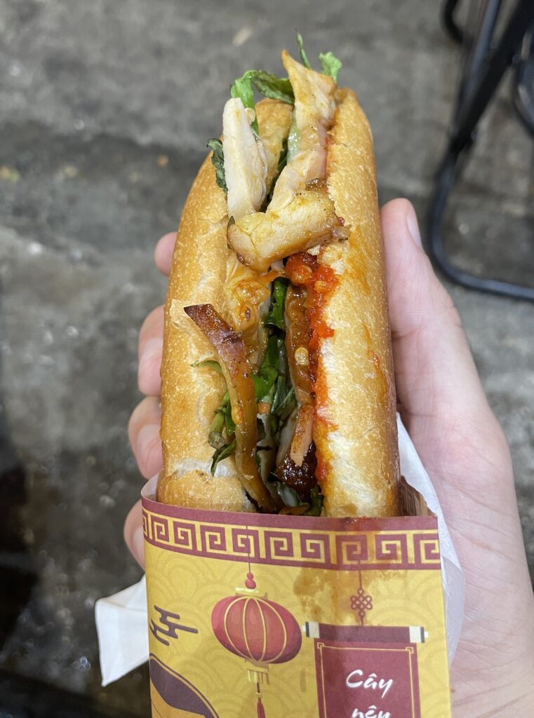 a chicken banh mi sandwich full of toppings