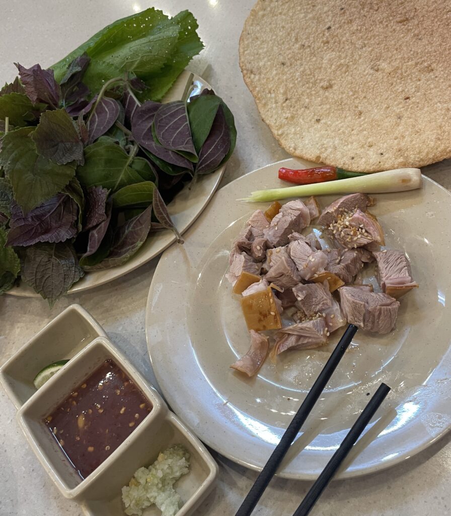 fatty pieces of goat meat with fresh herbs