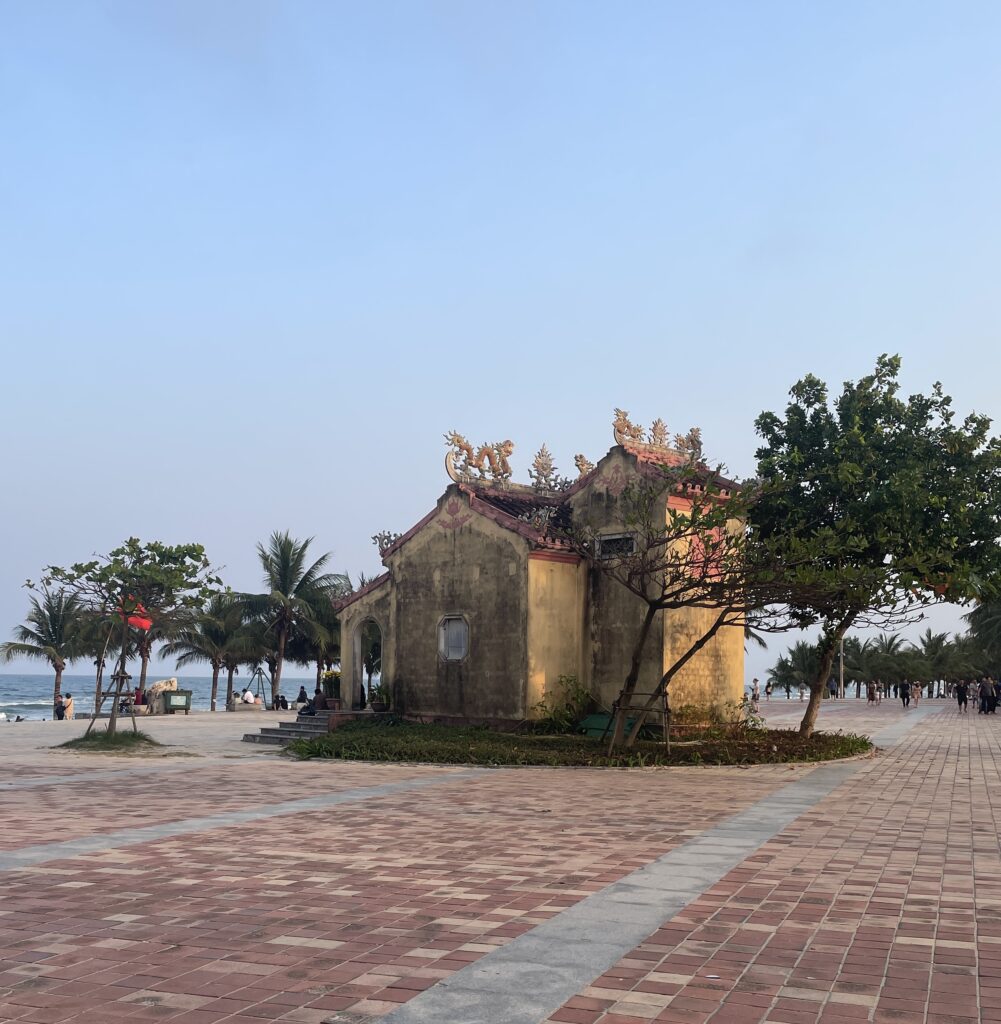 old building built amongst the boardwalk at My Khe Beach in Da Nang, Vietnam 
