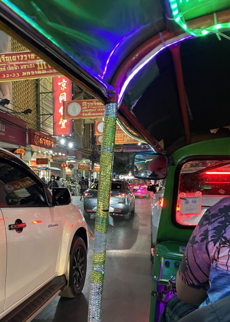 man driving tuk tuk in Bangkok