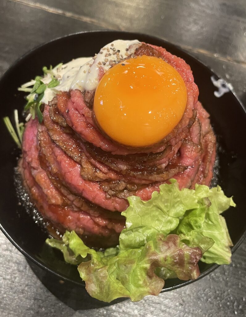 roast beef bowl with egg yolk
