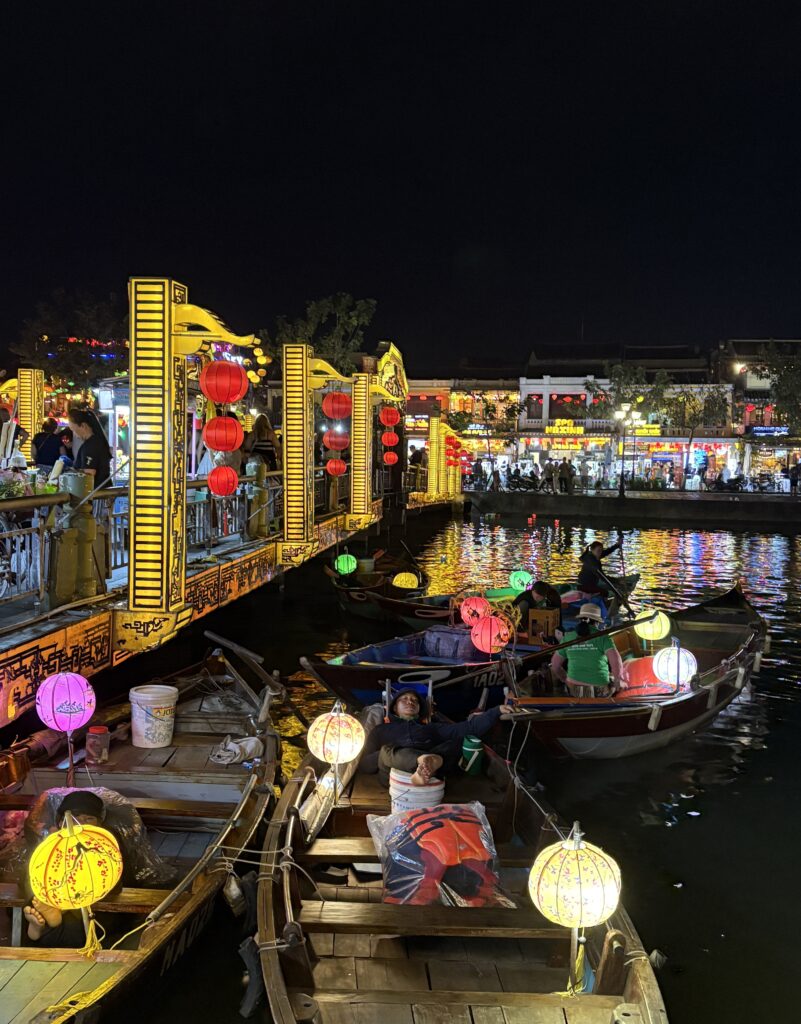 boats with lanterns in the centre of Hoi An's ancient old town at night 