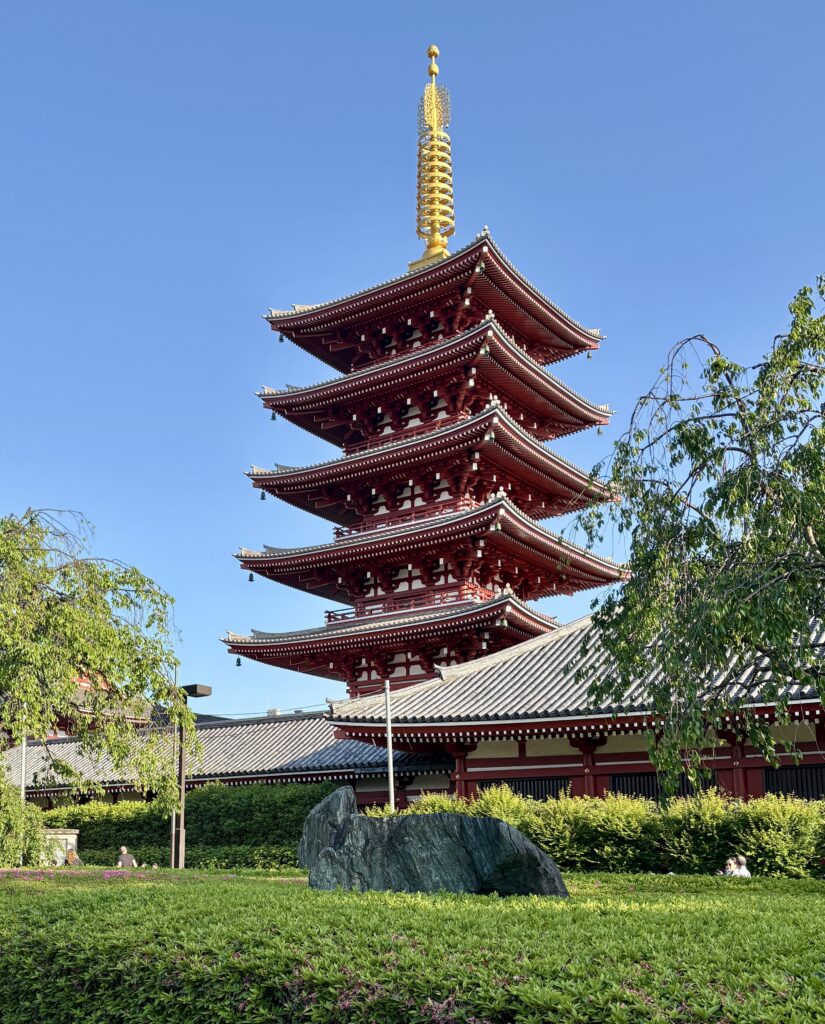 Historic Sensoji Temple in Asakusa Tokyo with tourists exploring the grounds