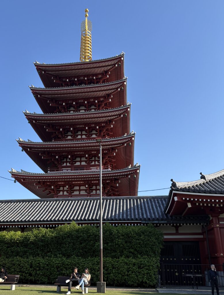 Tall shrine standing in Asakusa district on a sunny summer day in Tokyo