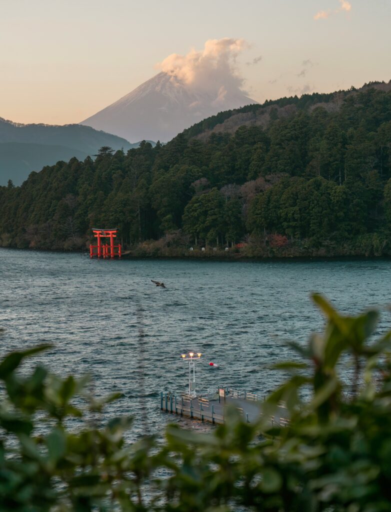 Scenic view of lake in Hakone with temple visible in the distance