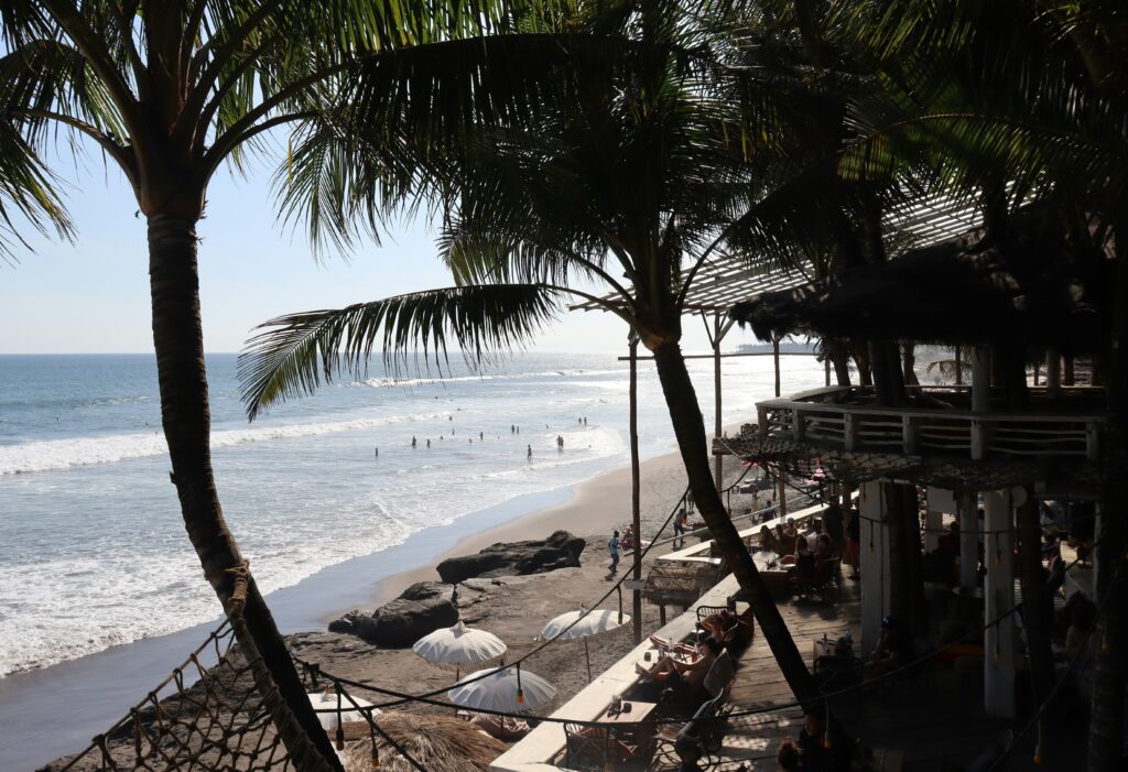 Rustic, boho-style setting at La Brisa Beach Club in Canggu, Bali with ocean views and cozy lounges
