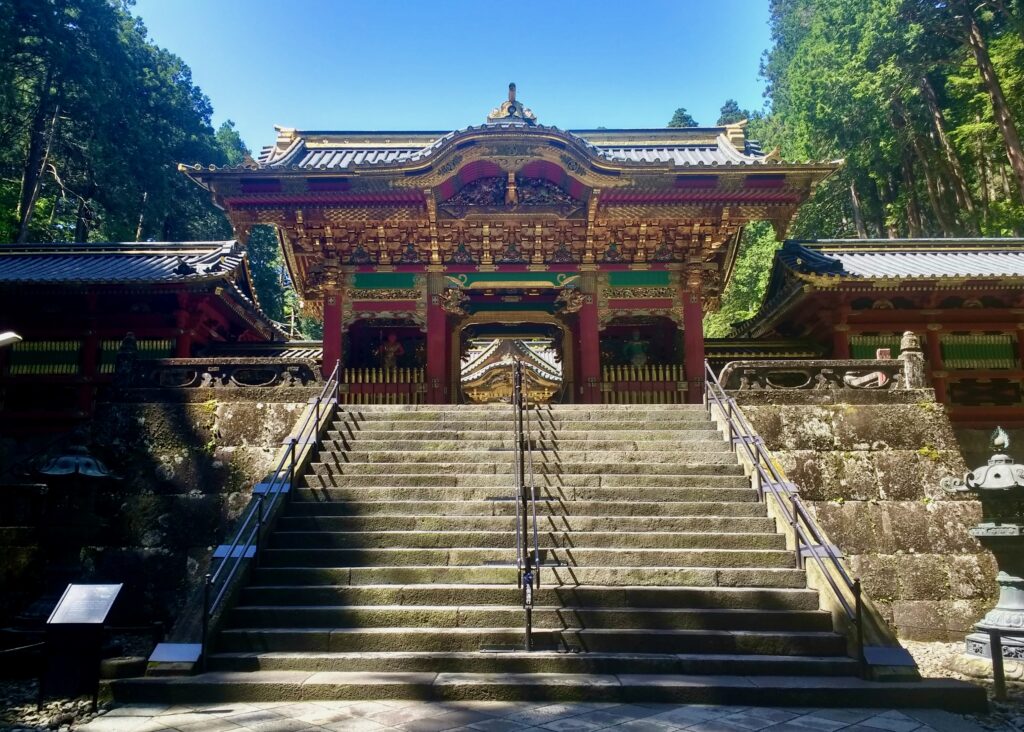 Toshogu Shrine in Nikko with ornate carvings and historic architecture surrounded by forested mountains