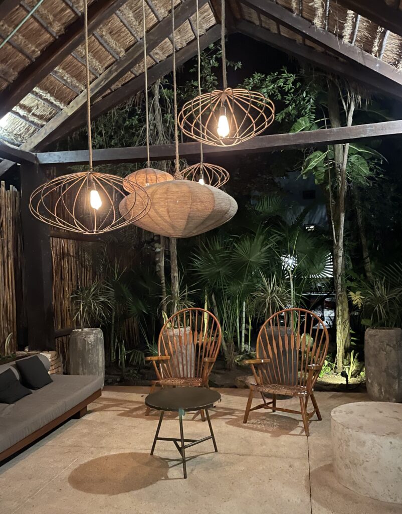Boho chic interior of a villa in Aldea Zama Tulum with rustic furniture and tropical decor