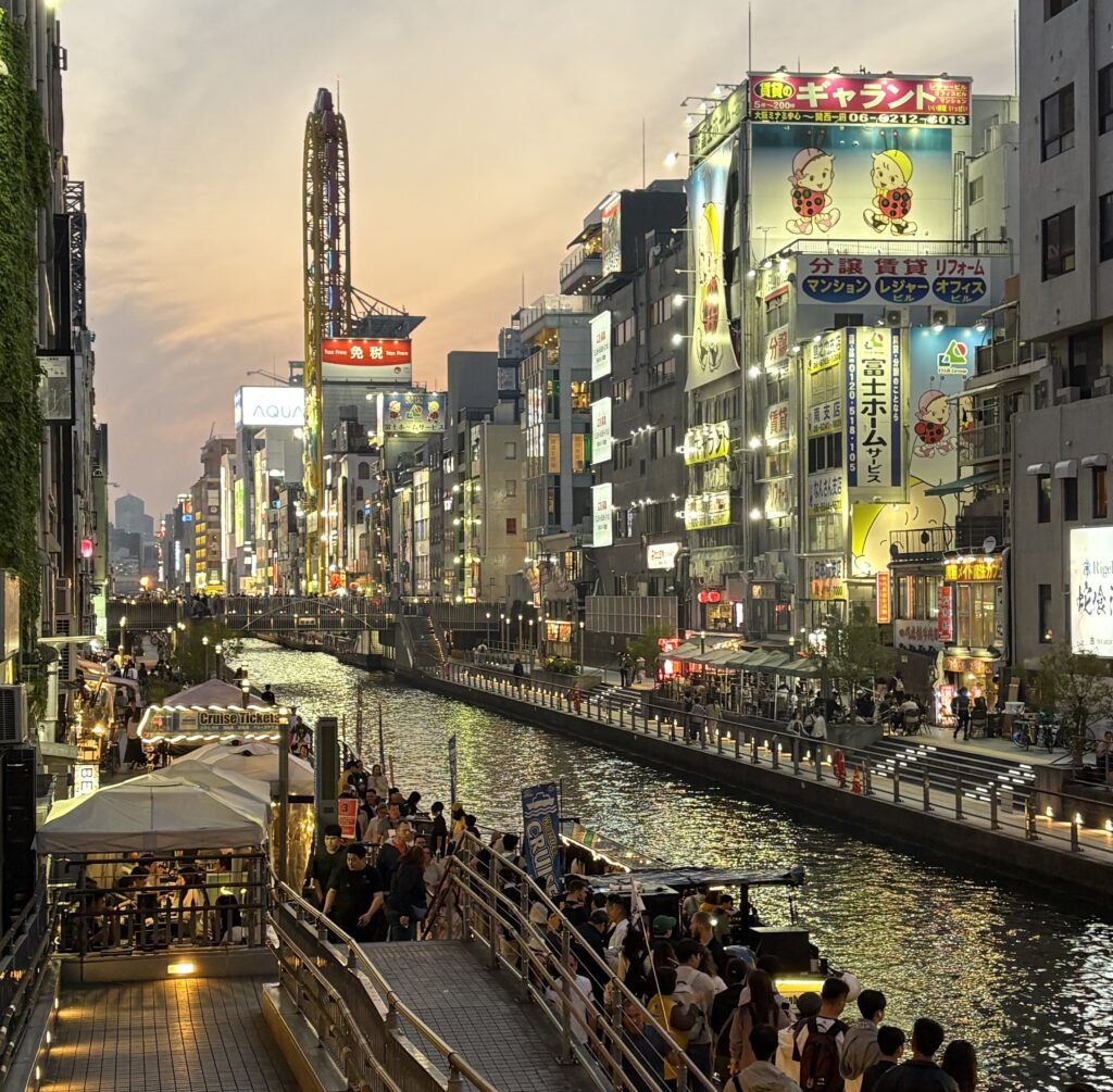 Dotonbori canal at sunset in Osaka, Japan. One of the best places to visit for food, lights, and atmosphere