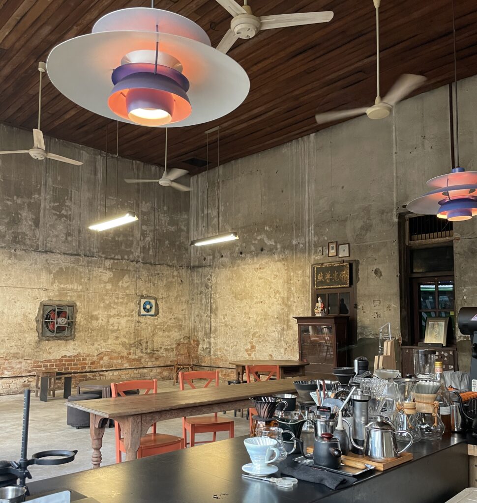 Charming minimalist interior of Flo Coffee Brewers, a specialty coffee shop in Chiang Mai, Thailand.
