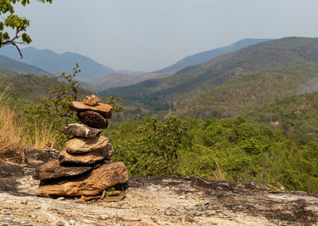 Stunning midday landscape of rolling hills in the Hang Dong area of Chiang Mai, Thailand.
