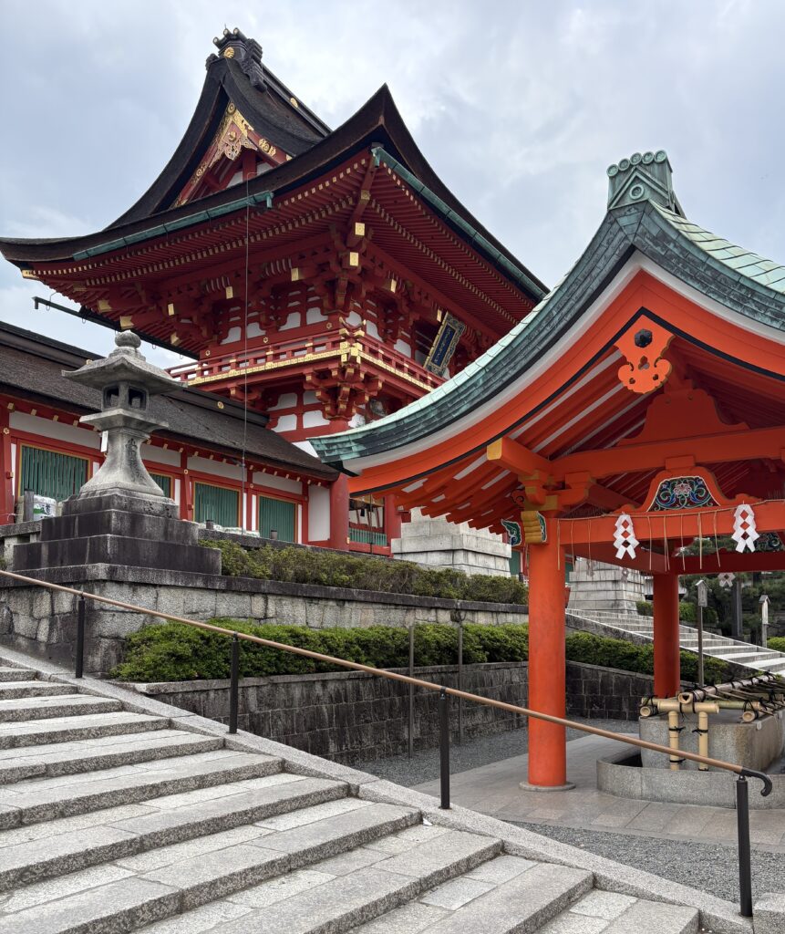 Bright orange temple buildings and classic Japanese architectural details at Kyoto’s Kiyomizu-dera.