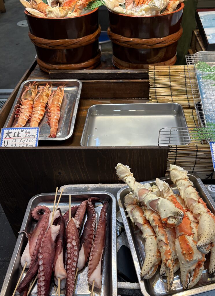 Fresh lobster legs and octopus on display at Kuromon Ichiba Market in Osaka, Japan