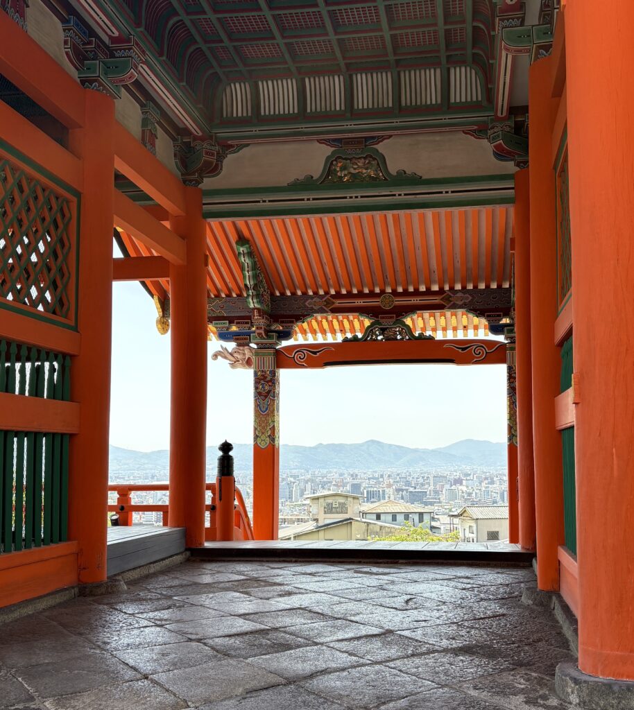 Stunning mountain view seen from a temple in Kyoto, blending natural beauty with traditional architecture.
