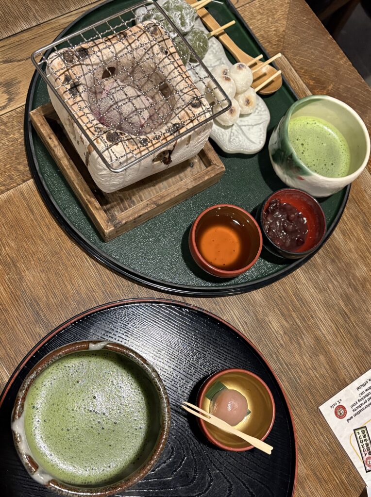 Traditional Kyoto matcha experience with grilled mochi on a charcoal tray and hot matcha cups in a Japanese tea house setting.