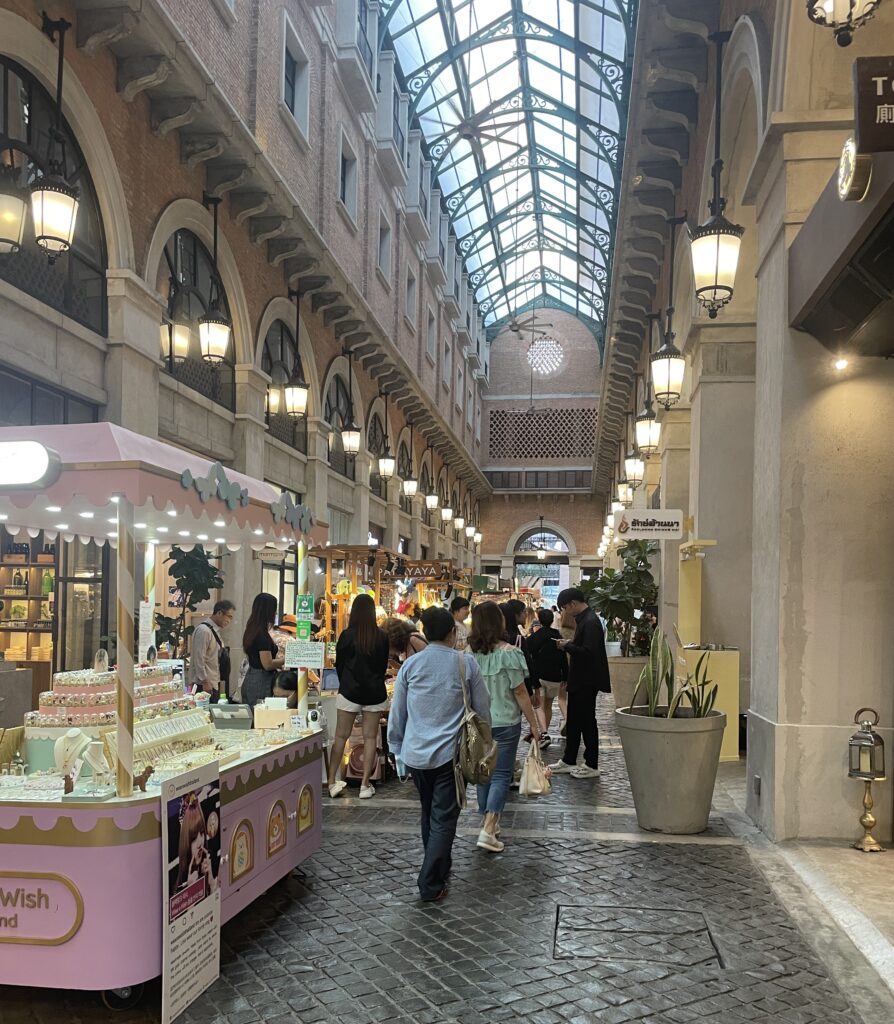 Tourists and locals walking around the stylish One Nimman shopping and lifestyle area in the Nimman neighborhood of Chiang Mai.
