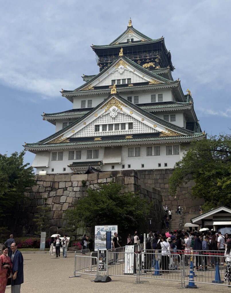 Osaka Castle with cherry blossoms in Nishinomaru Garden