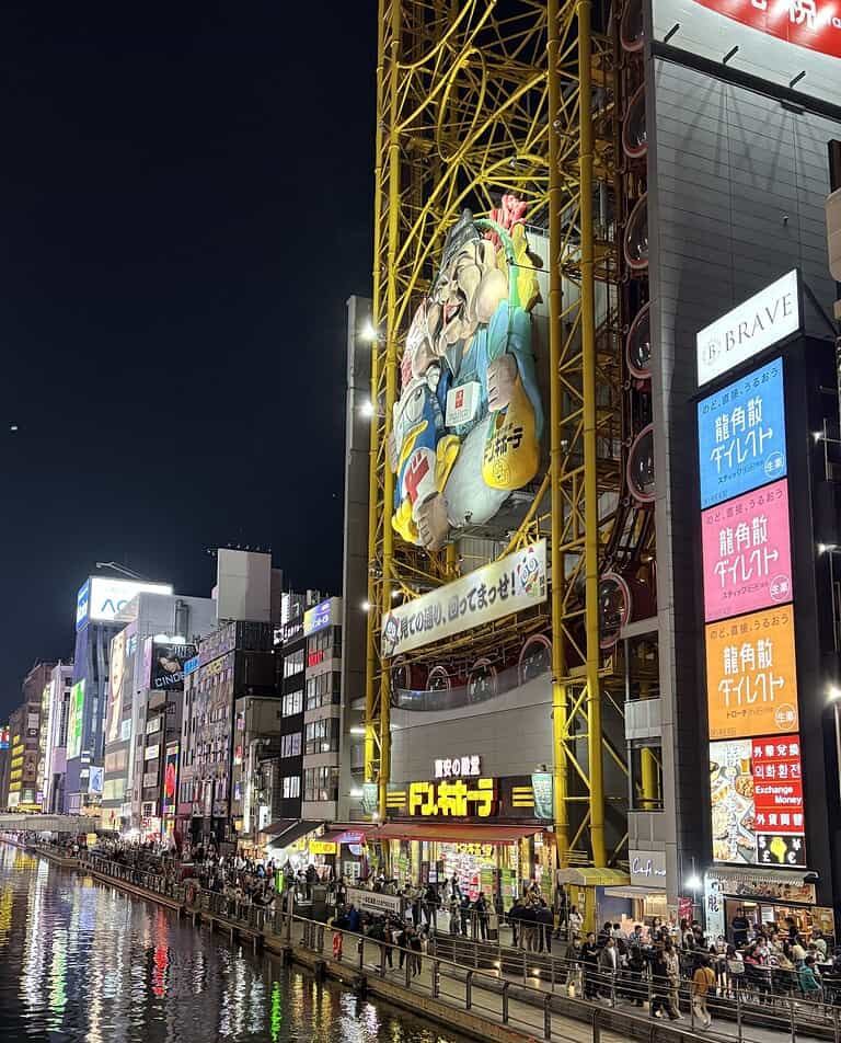 Vibrant river view in Osaka” to ensure Osaka is the first anchor term, and sets the scene as iconic and welcoming — matching a featured image’s role.