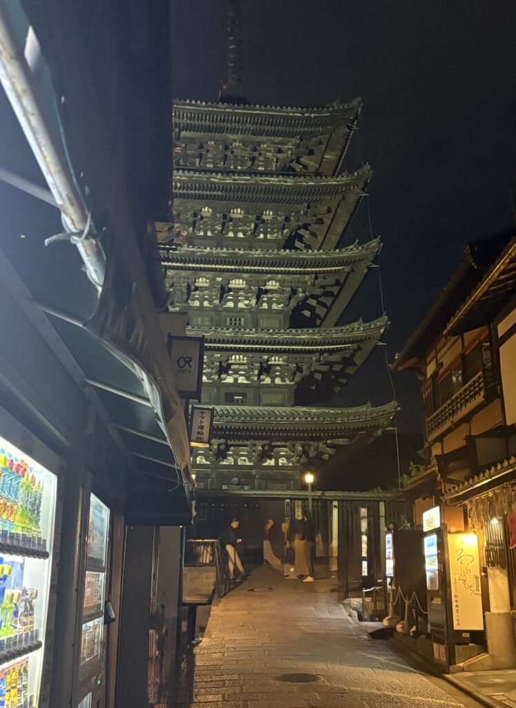 Traditional view along Sannenzaka Slope in Kyoto with cobblestone path leading to a historic temple