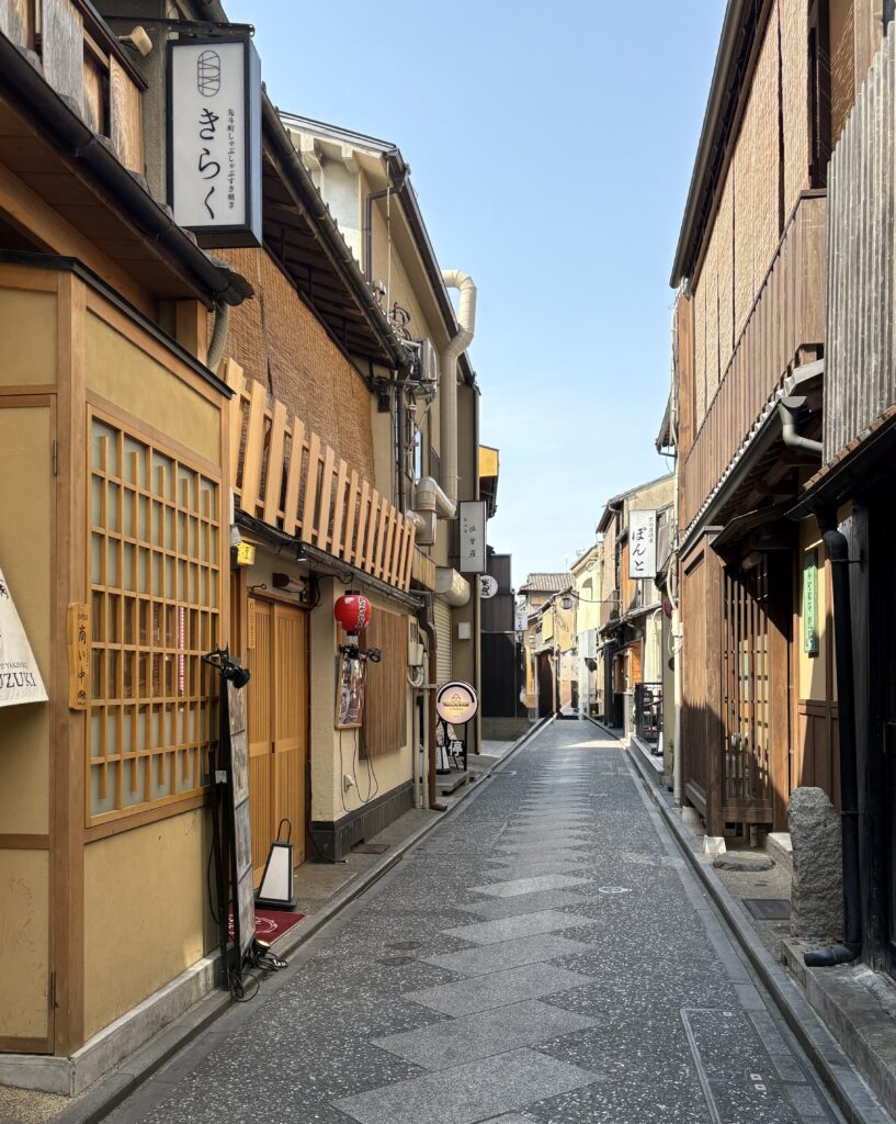 Traditional wooden houses line a peaceful street in Kyoto’s historic district.