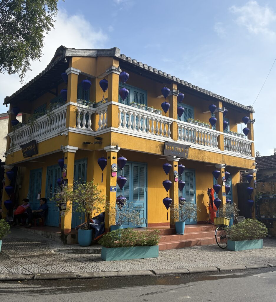 Yellow-painted heritage building on a corner in Hoi An Old Town, Vietnam