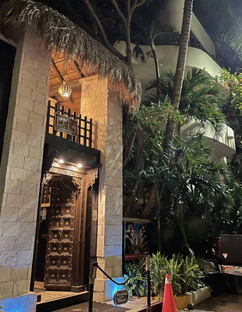 Charming hotel with a traditional palapa roof in the Zazil-Ha area of Playa del Carmen, surrounded by tropical greenery and close to the beach.
