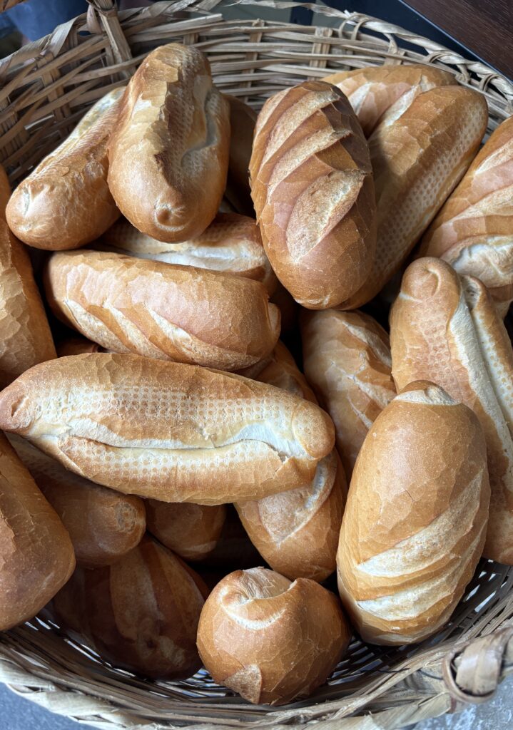 a large batch of fresh Banh Mi bread in Saigon