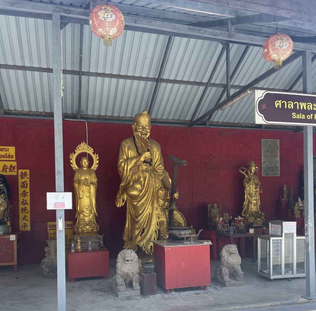 Golden Buddha statues displayed at the Big Buddha temple in Phuket, Thailand.