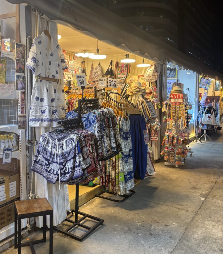 Elephant pants and clothing stalls at Jodd Fair Night Market in Bangkok
