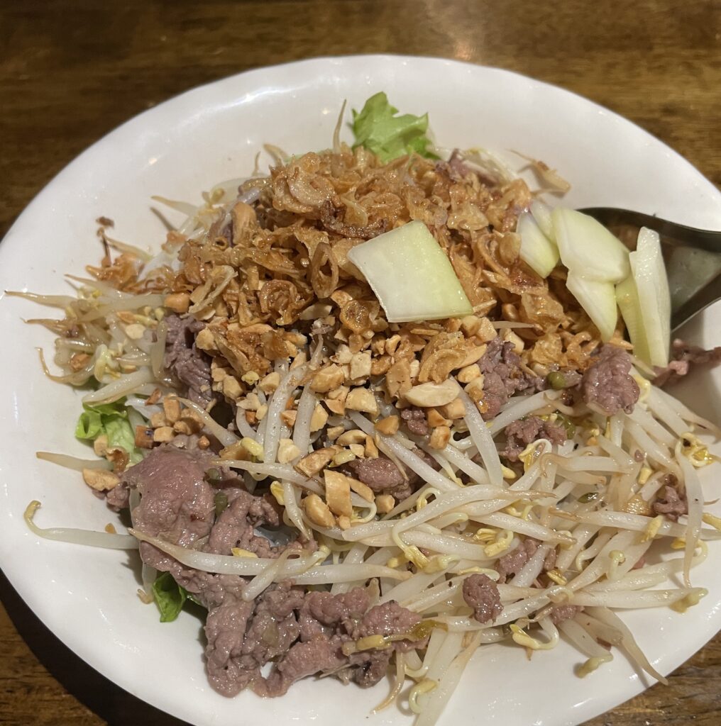 A bowl of Bún Bò Xào, Vietnamese stir-fry beef noodle salad, being served in Hanoi.