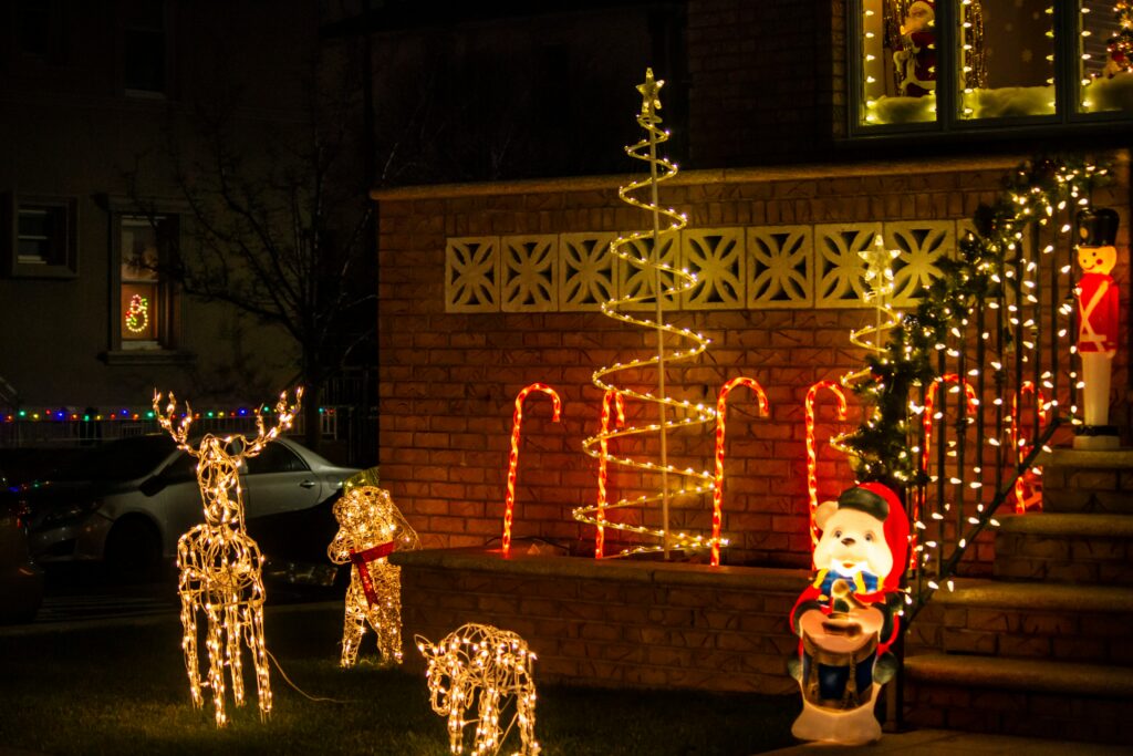 Lit-up Christmas house display at Dyker Heights holiday lights in Brooklyn.
