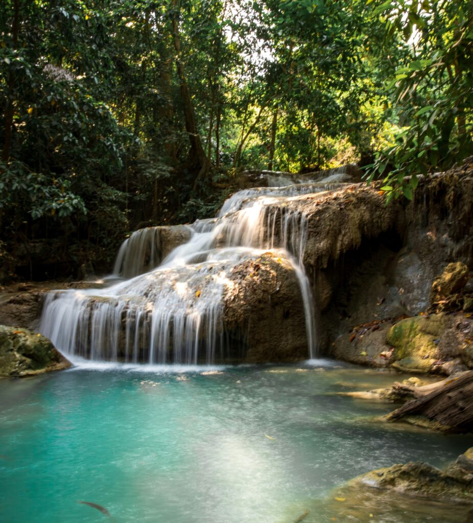Erawan Falls in Kanchanaburi Thailand turquoise waterfall surrounded by lush jungle