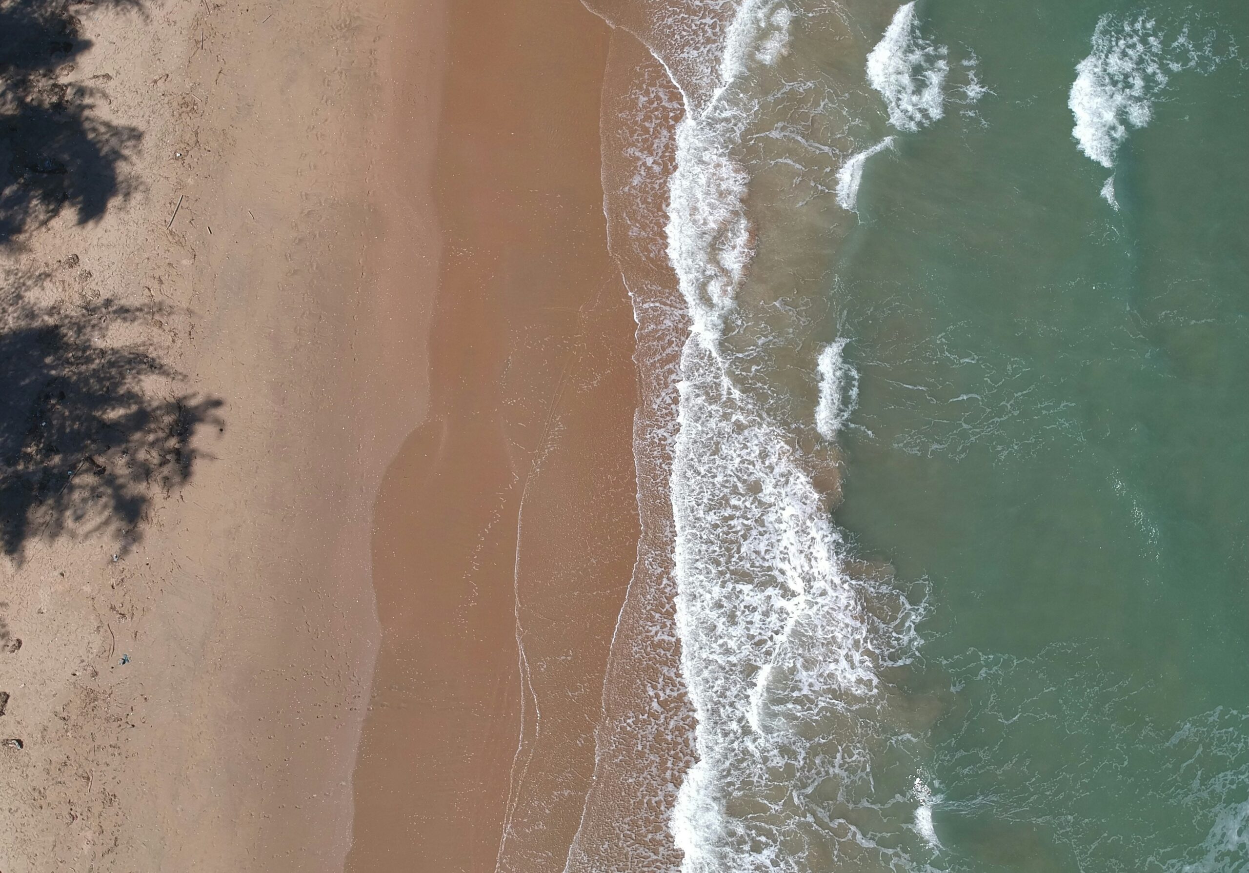 Aerial view of Hua Hin beach in Thailand with clear waters and sandy shoreline