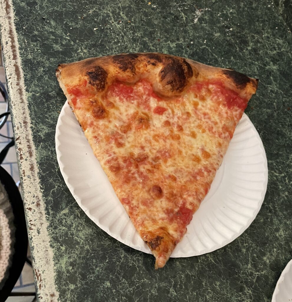 Slice of Joe's Pizza at the original Greenwich Village location in NYC