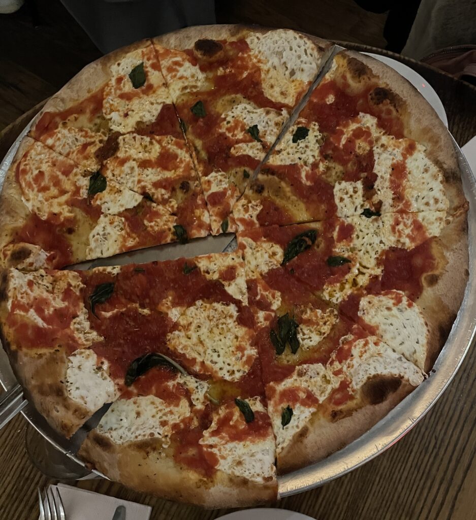 Close-up shot of a fresh pizza at Juliana’s in Brooklyn’s DUMBO neighborhood, New York City
