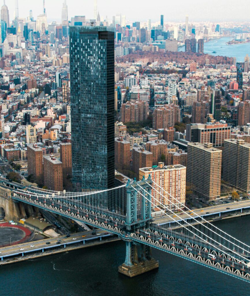 Helicopter aerial view of the Manhattan Bridge spanning the East River in New York City