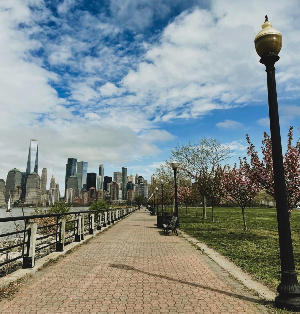 Walkway lamp beside the water in New York City during a midafternoon walk with early signs of spring in the air.