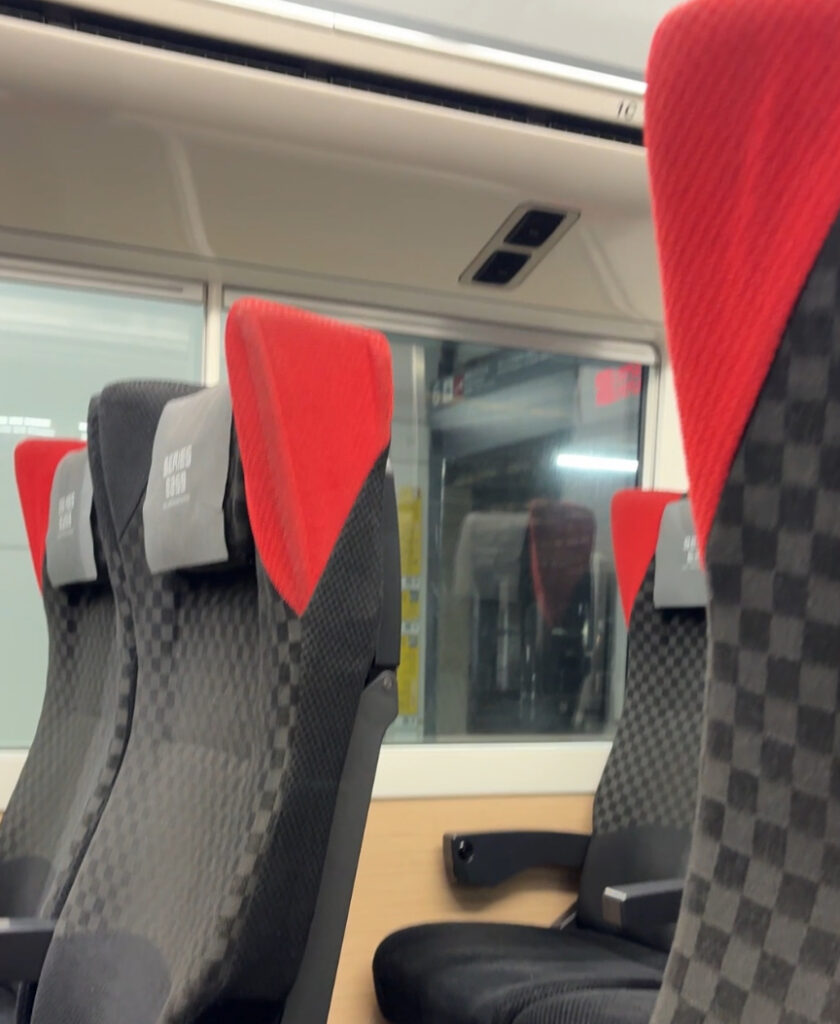 Narita Express train departing for Tokyo from Narita Airport, a popular airport transfer option in Japan