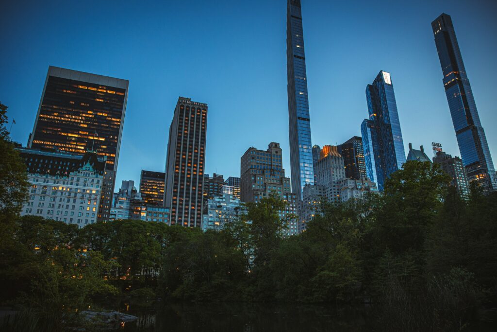 View of Billionaires’ Row skyscrapers from Central Park in New York City at dusk.