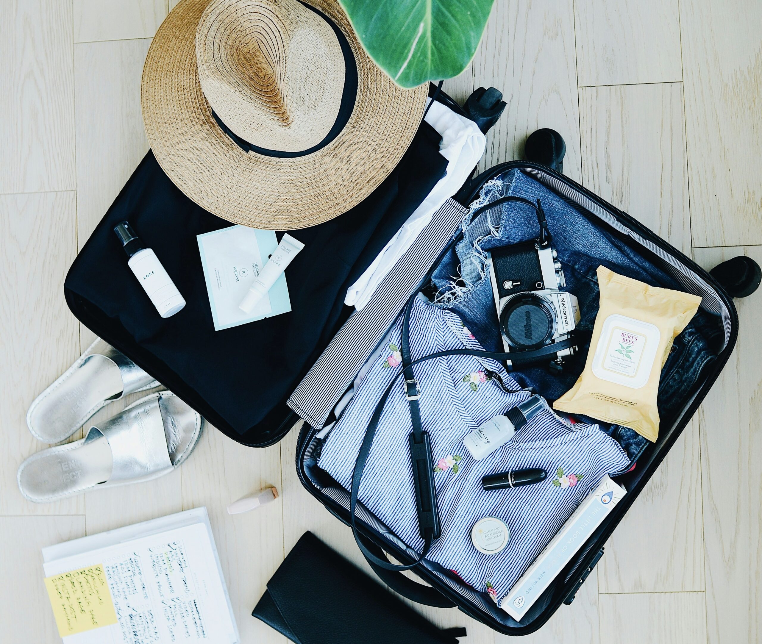 suitcase being packed with travel essentials for a trip to Thailand