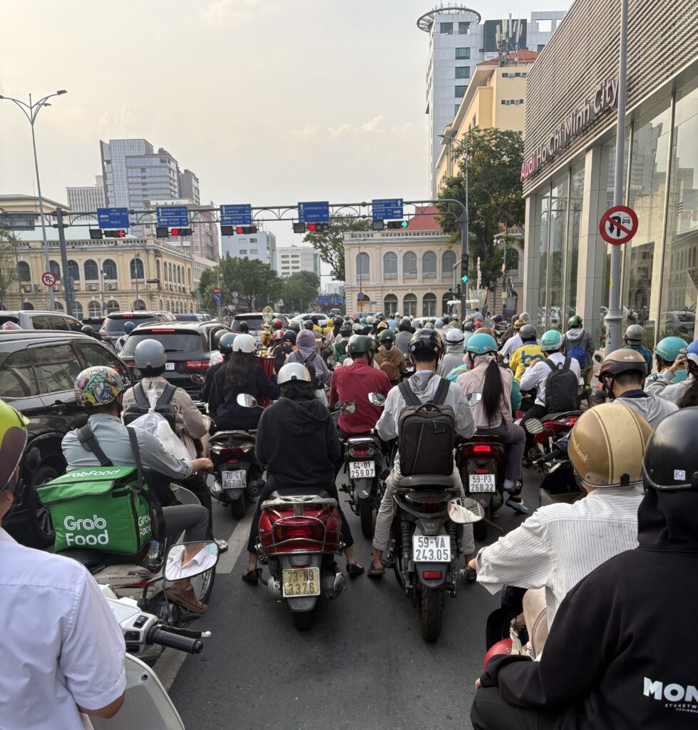 Hundreds of scooters crowd the streets during rush hour in Saigon, Vietnam.