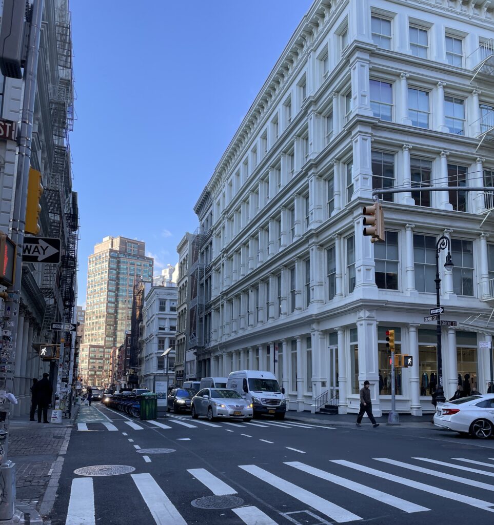 Stunning corner building in SoHo, New York City, with afternoon winter street view.