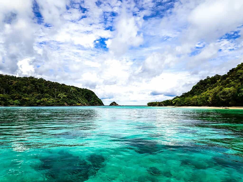 Crystal-clear, transparent waters at Koh Rok in Krabi, Thailand, with vibrant blue hues and tropical scenery.